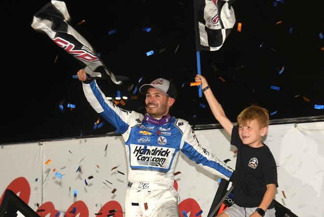 Kyle Larson celebrates with his son after winning a second Knoxville Nationals title Saturday at Knoxville Raceway.