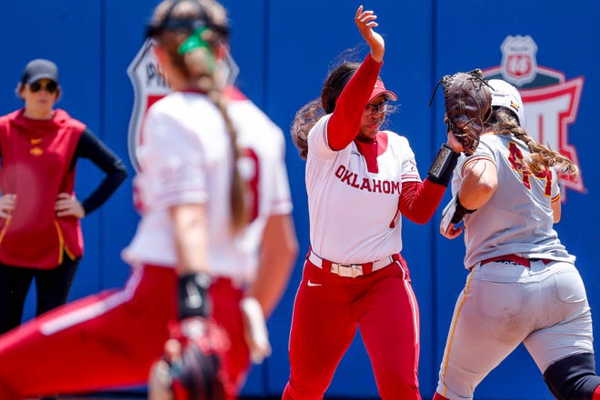 Oklahoma first base Cydney Sanders (1) tags Iowa State catcher Mikayla Ramos (44) out at first during the Big 12 softball tournament game between the Oklahoma Sooners and the Iowa State Cyclones at USA Softball Hall of Fame Stadium in Oklahoma City, on Friday, May 12, 2023.