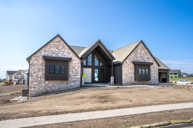 Live in this new modern Tudor home with 3,900 square feet of finished space built by Eagle Homes for $1.35 million in Urbandale.