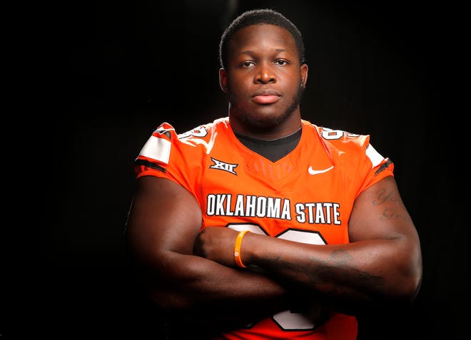 Oklahoma State's Collin Clay poses for a photo during media for the Oklahoma State University Cowboys football media days in Stillwater, Okla., Saturday, Aug., 5, 2023.