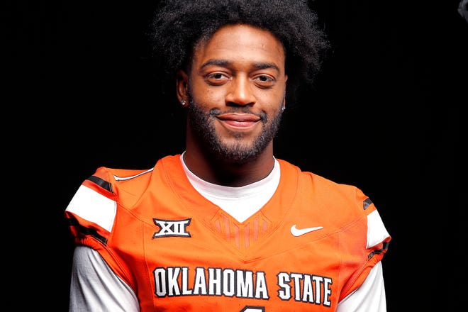 Oklahoma State's Xavier Benson poses for a photograph during media for the Oklahoma State University Cowboys football media days in Stillwater, Okla., Saturday, Aug., 5, 2023.