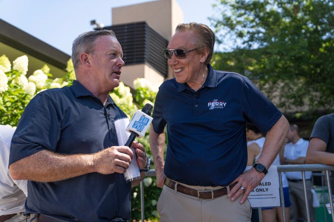 Republican Businessman Perry Johnson is interviewed by Sean Spicer before speaking on the Des Moines Register Political soapbox on Friday, Aug. 11, 2023, at the Iowa State Fair, in Des Moines.
