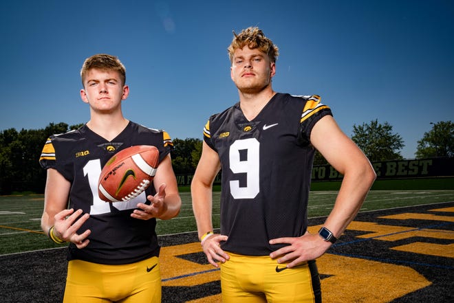 Iowa kicker Drew Stevens (#18) and punter Tory Taylor (#9) stand for a photo during Hawkeyes Football media day in Iowa City, Friday, Aug. 11, 2023.