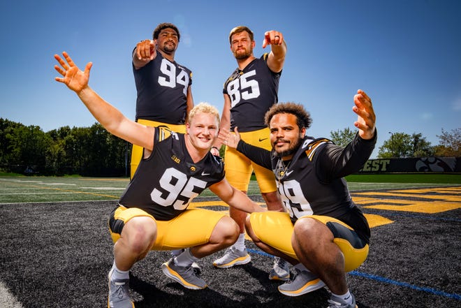 Defensive tackles Yahya Black (#94), Logan Lee (#85), , Aaron Graves (#95), and Noah Shannon (#99) stand for a photo during Hawkeyes Football media day in Iowa City, Friday, Aug. 11, 2023.