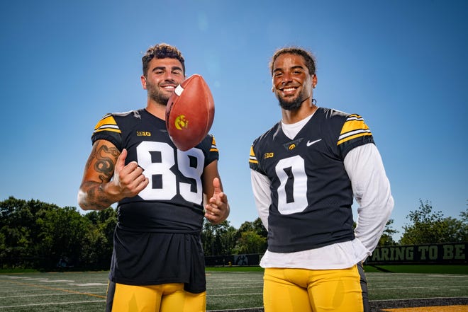 Wide receivers Nico Ragaini (#89) and Diante Vines (#0) stand for a photo during Hawkeyes Football media day in Iowa City, Friday, Aug. 11, 2023.