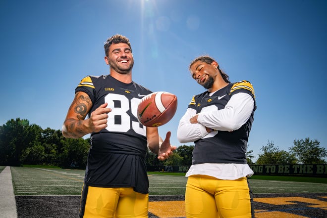 Wide receivers Nico Ragaini (#89) and Diante Vines (#0) stand for a photo during Hawkeyes Football media day in Iowa City, Friday, Aug. 11, 2023.