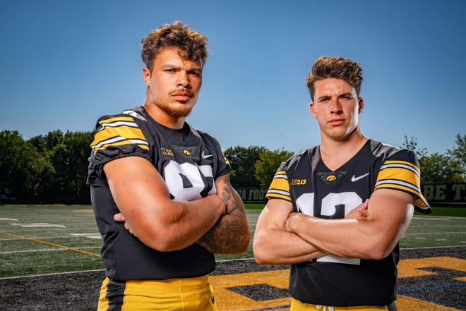 Tight end Erick All (#83) and quarterback Cade McNamara (#12) stands for a photo during Hawkeyes Football media day in Iowa City, Friday, Aug. 11, 2023.