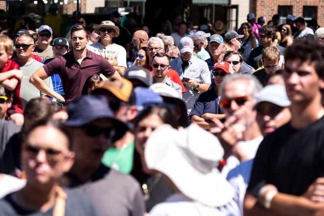 People watch as GOP presidential candidate Vivek Ramaswamy speaks at the Des Moines Register Political Soapbox during day three of the Iowa State Fair on Saturday, August 12, 2023 in Des Moines.