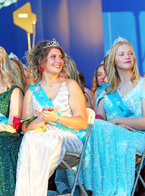 Kalayna Durr, left, of Henry Country claps as other contestants are introduced during the annual Iowa State Fair Queen Coronation on the Anne and Bill Riley Stage at the Iowa State Fair on Saturday, Aug. 12, 2023, in Des Moines.