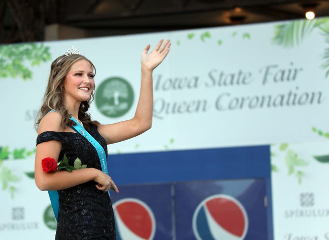 Natalie Behnken of Cass County waves during the annual Iowa State Fair Queen Coronation on the Anne and Bill Riley Stage at the Iowa State Fair on Saturday, August 12, 2023, in Des Moines.