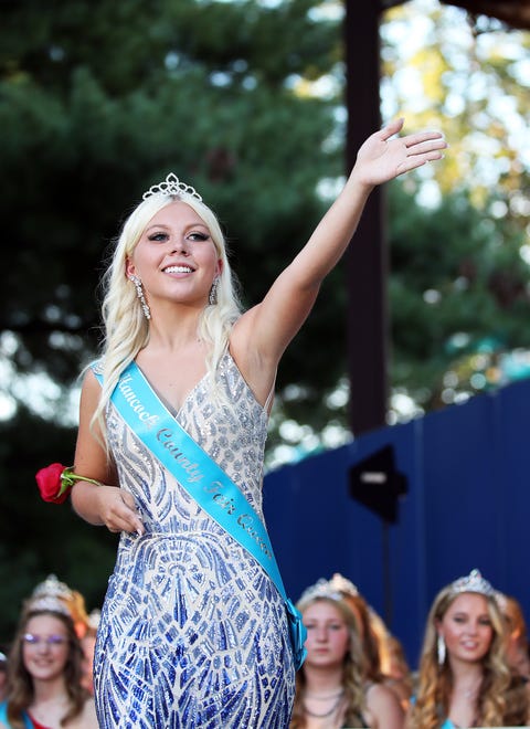 Sydney Tue of Hancock County waves during the annual Iowa State Fair Queen Coronation on the Anne and Bill Riley Stage at the Iowa State Fair on Saturday, August 12, 2023, in Des Moines.