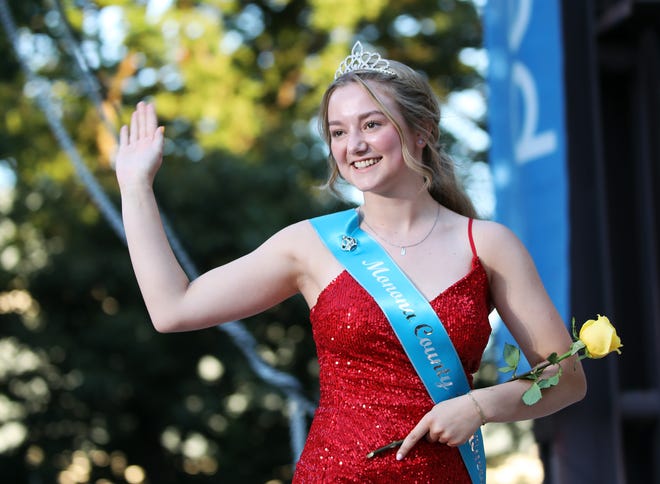 Addison Halverson of Monona County waves during the annual Iowa State Fair Queen Coronation on the Anne and Bill Riley Stage at the Iowa State Fair on Saturday, August 12, 2023, in Des Moines.