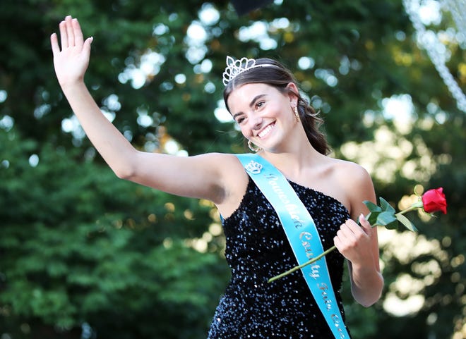 Jordan Ranfeld of Poweshiek waves to the crowd during the annual Iowa State Fair Queen Coronation on the Anne and Bill Riley Stage at the Iowa State Fair on Saturday, August 12, 2023, in Des Moines.