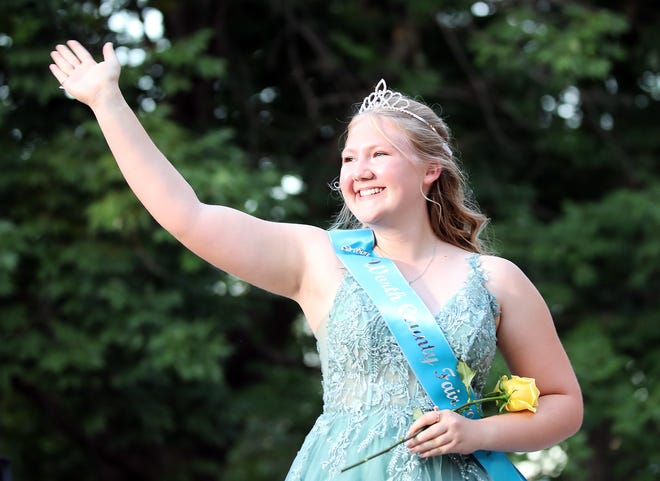 Sydney Schilling of Worth County waves to the crowd during the annual Iowa State Fair Queen Coronation on the Anne and Bill Riley Stage at the Iowa State Fair on Saturday, August 12, 2023, in Des Moines.