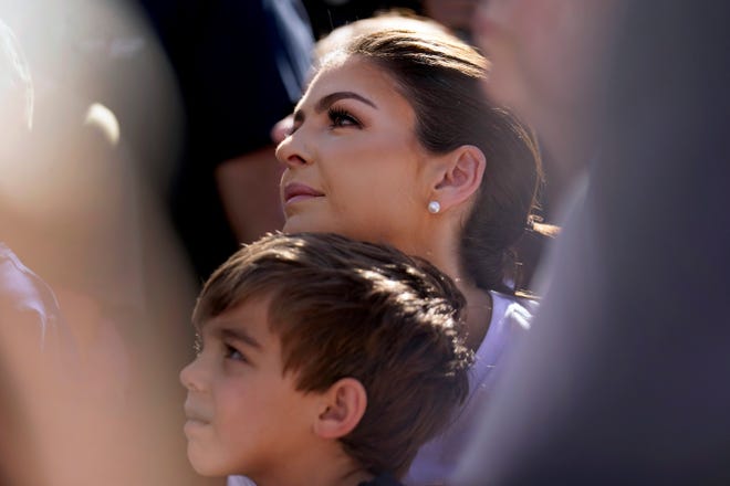 Casey DeSantis holds her son, Mason, as she listens while her husband, Republican presidential candidate Florida Gov. Ron DeSantis, speaks during a Fair-Side Chat with Iowa Gov. Kim Reynolds at the Iowa State Fair, Saturday, Aug. 12, 2023, in Des Moines, Iowa. (AP Photo/Jeff Roberson)