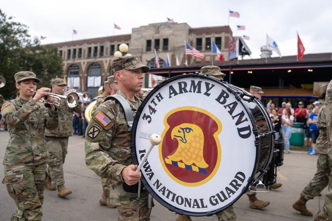 The Iowa National Guard Army Band marches down the Grand Concourse of the Iowa State Fair during the Veteran's Day Parade, on Monday, Aug. 14, 2023, in Des Moines.