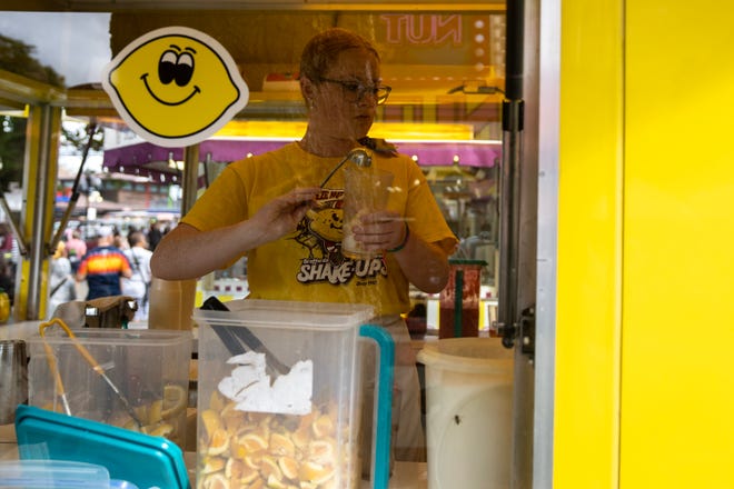 Brafford's Lemonade Stand prepares and sells lemonade at the Iowa State Fair, on Monday, Aug. 14, 2023, in Des Moines.