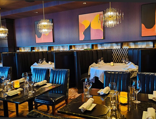 Large Hollywood booths decorate the first-floor dining room at Ruth's Chris Steak House in West Des Moines.