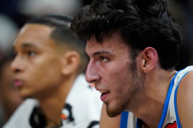 Oklahoma City Thunder forward Chet Holmgren, right, looks on from the bench in the first half during an NBA Summer League basketball game against the Utah Jazz, Monday, July 3, 2023, in Salt Lake City. (AP Photo/Rick Bowmer)