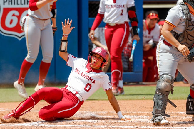 Oklahoma outfielder Rylie Boone (0) slides into first base during the Big 12 softball tournament game between the Oklahoma Sooners and the Iowa State Cyclones at USA Softball Hall of Fame Stadium in Oklahoma City, on Friday, May 12, 2023.