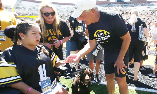 Iowa football head coach Kirk Ferentz talks to kid captains  during Kids' Day at Kinnick Stadium on Saturday, Aug. 12, 2023, in Iowa City, Iowa