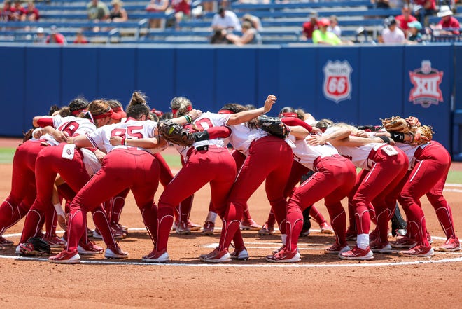 Oklahoma players get ready to play in the Big 12 softball tournament game between the Oklahoma Sooners and the Iowa State Cyclones at USA Softball Hall of Fame Stadium in Oklahoma City, on Friday, May 12, 2023.