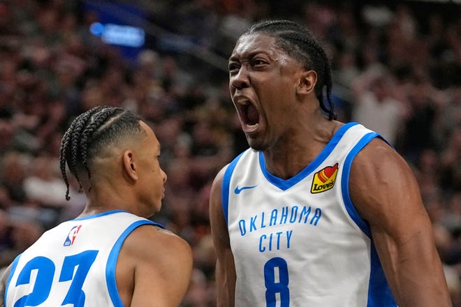 Oklahoma City Thunder's Jalen Williams (8) celebrates with Tre Mann (23) after a dunk against the Utah Jazz in the first half during an NBA Summer League basketball game Monday, July 3, 2023, in Salt Lake City. (AP Photo/Rick Bowmer)