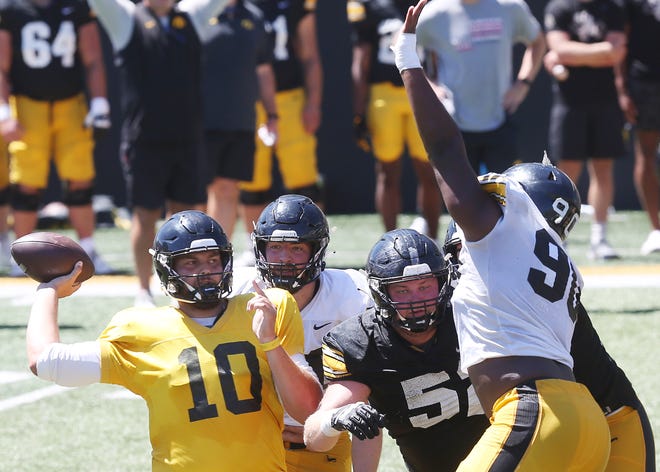 Iowa quarterback Deacon Hill (10) throws the ball as defensive end Brian Allen attempts to block during scrimmage in the Kids' Day at Kinnick Stadium on Saturday, Aug. 12, 2023, Iowa City, Iowa
