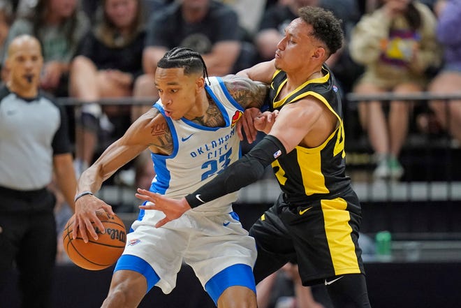 Utah Jazz guard Colbey Ross, right, defends against Oklahoma City Thunder guard Tre Mann (23) in the second half during an NBA Summer League basketball game Monday, July 3, 2023, in Salt Lake City. (AP Photo/Rick Bowmer)