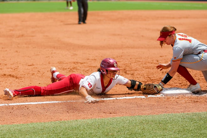 Oklahoma utility Alyssa Brito (33) slides into third safe during the Big 12 softball tournament game between the Oklahoma Sooners and the Iowa State Cyclones at USA Softball Hall of Fame Stadium in Oklahoma City, on Friday, May 12, 2023.